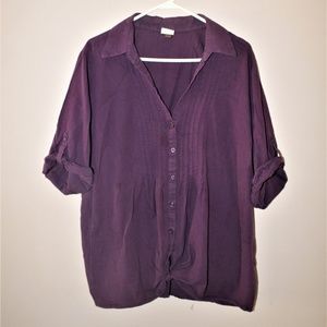 Purple button up shirt. Short sleeve.